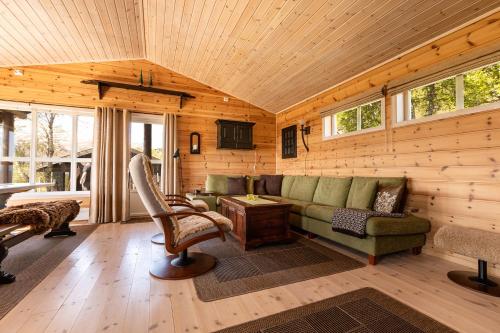 a living room with a couch and a table at Valley View in Stranda