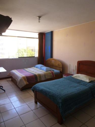 Voodi või voodid majutusasutuse Hospedaje Centro toas