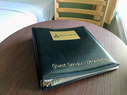 a book sitting on top of a table at Marlane Motel in Wildwood
