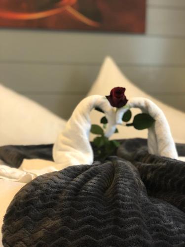 a stuffed animal sitting on top of a bed at Hotel Vogelweiderhof in Salzburg