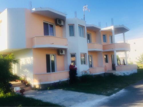 a person standing in front of a building at Apartments Beti in Ulcinj