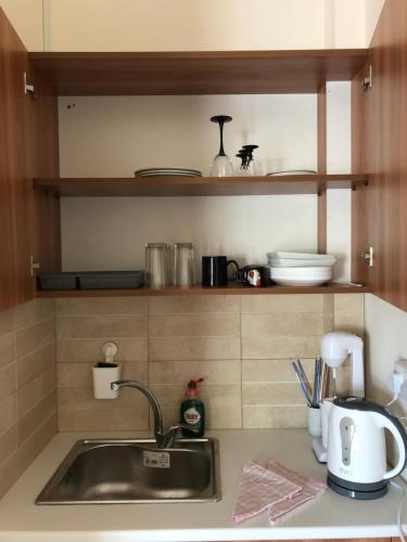 a kitchen counter top with a sink and a counter top at Lucky 4 in Paralimni