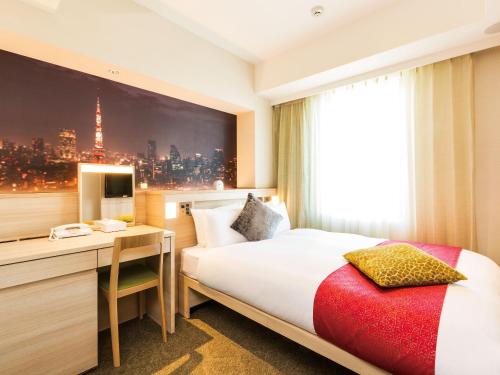 a hotel room with a bed and a desk at Hotel JAL City Haneda Tokyo West Wing in Tokyo
