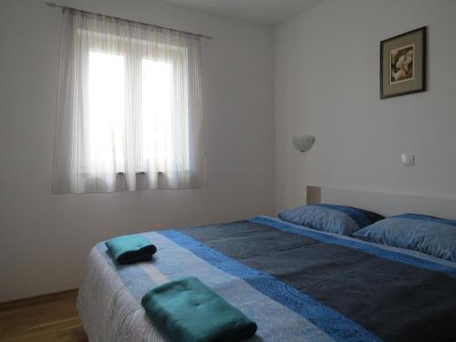 Ένα ή περισσότερα κρεβάτια σε δωμάτιο στο Apartment DENIS