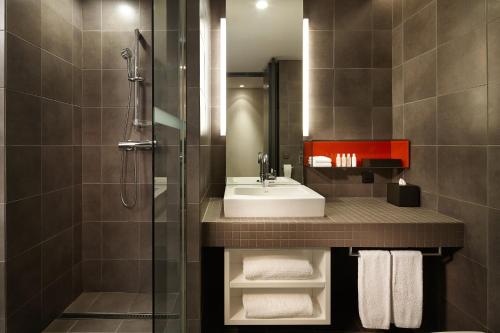 a bathroom with a sink and a shower at Shilla Stay Gwanghwamun Myeongdong in Seoul
