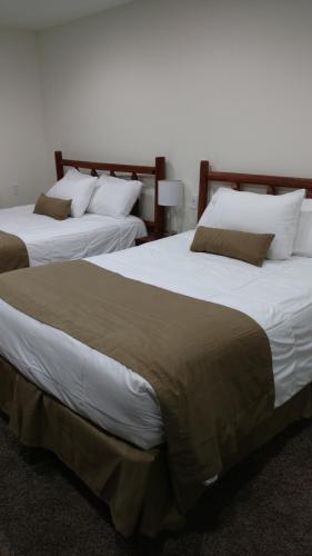 Postel nebo postele na pokoji v ubytování Cattlemen Motel
