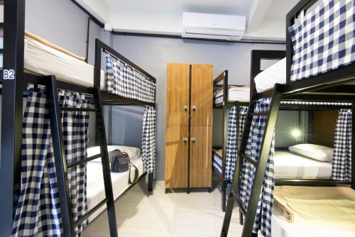 a dorm room with a bunch of bunk beds at Arun Old Town in Bangkok