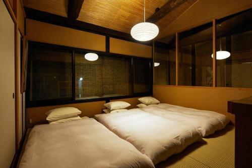 Llit o llits en una habitació de Marukyo Gakurin-an