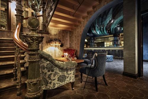 a restaurant with a table and chairs in a room at Stora Hotellet; BW Premier Collection in Umeå