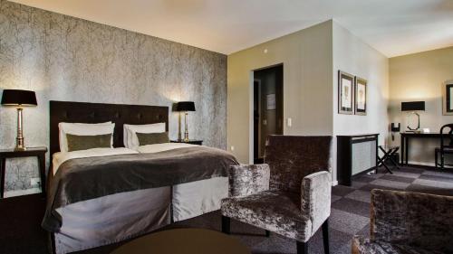 Ein Bett oder Betten in einem Zimmer der Unterkunft Hotel Kronjylland