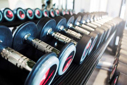 a row of dumbbells in a gym at Best Western Hotel Baltic in Sundsvall