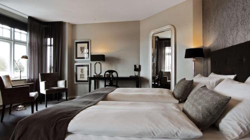 Ein Bett oder Betten in einem Zimmer der Unterkunft Hotel Kronjylland