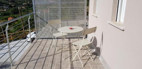 a white table and chairs on a balcony at Stella Marina Agropoli in Agropoli