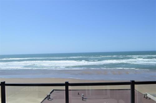 a view of the ocean from a balcony at Beachfront Manor Hotel in Lincoln City