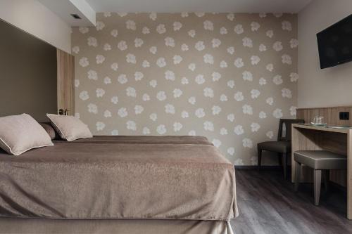 Postel nebo postele na pokoji v ubytování Hotel Civera