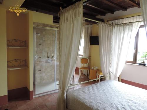 a bedroom with a bed and a shower at Villa Floridiana in Anagni