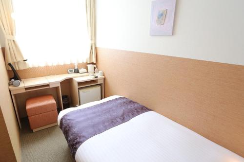 a hotel room with a bed and a desk at New Commander Hotel Osaka Neyagawa / Vacation STAY 1341 in Neyagawa