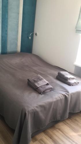 a bed with two towels on it in a room at Mieszkanie Świdnik in Świdnik