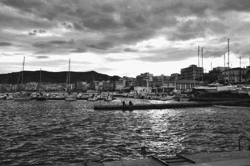 a group of people on a boat in a harbor at Central Apartments in Crotone