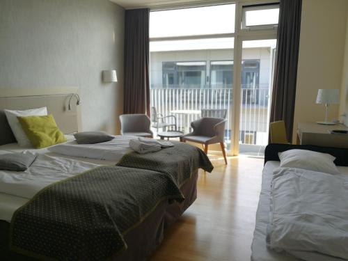 Postel nebo postele na pokoji v ubytování Storebælt Sinatur Hotel & Konference