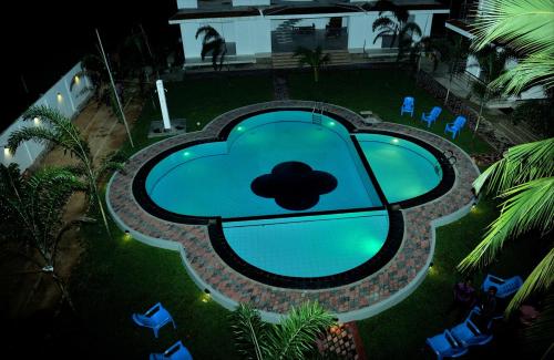 an overhead view of a pool with a cloud on it at Sunstar Nilaveli in Trincomalee