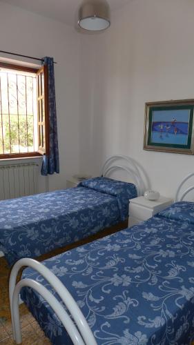 Letto o letti in una camera di B&B VILLA ELISA