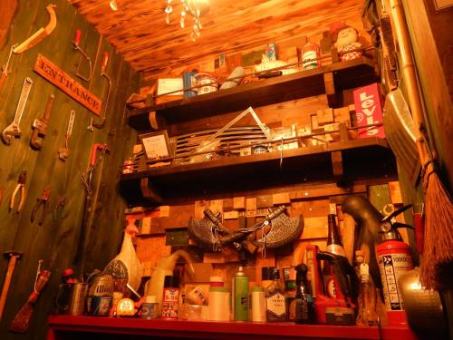 a room with a wall with lots of tools on it at Hostel Oomori Souko in Tokyo