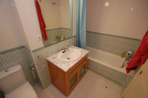 a bathroom with a sink and a toilet at Altos de Nuevo Vera in Vera