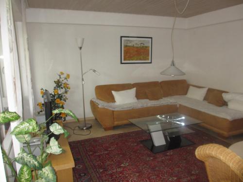 a living room with a couch and a table at Im Zentrum Hebelhof 2 Zi. in Freiburg im Breisgau