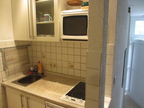 Kjøkken eller kjøkkenkrok på Im Zentrum Hebelhof 2 Zi.