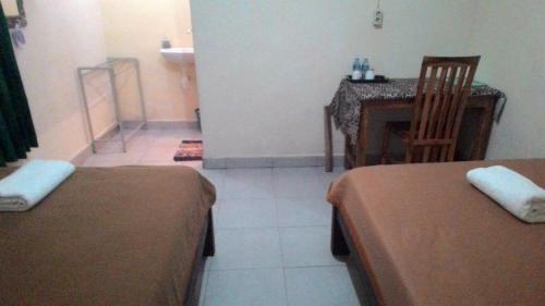 Cama ou camas em um quarto em Griya Bun Sari