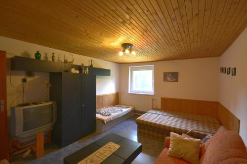A bed or beds in a room at Chalupa Slota