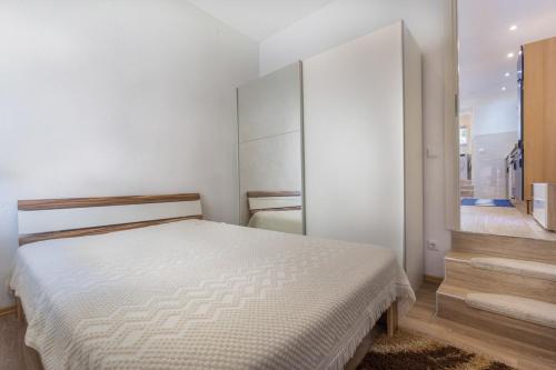 Ένα ή περισσότερα κρεβάτια σε δωμάτιο στο Apartment Arena