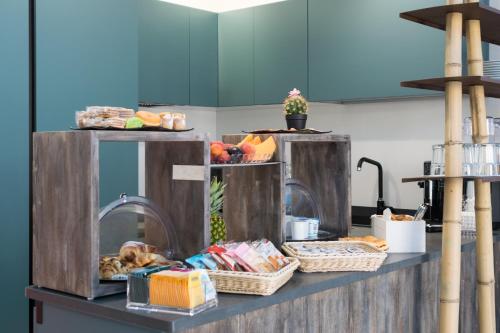 Η κουζίνα ή μικρή κουζίνα στο Isule Rooms & Breakfast
