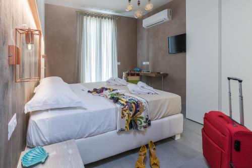 Ένα ή περισσότερα κρεβάτια σε δωμάτιο στο Isule Rooms & Breakfast