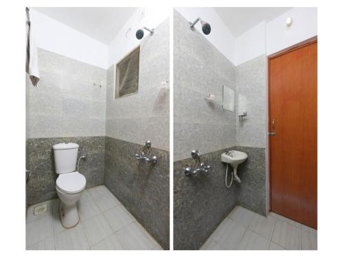 a bathroom with a toilet and a sink at Maruthi Residency in Chennai
