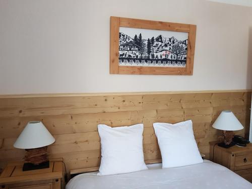 Ліжко або ліжка в номері Hotel de Geneve