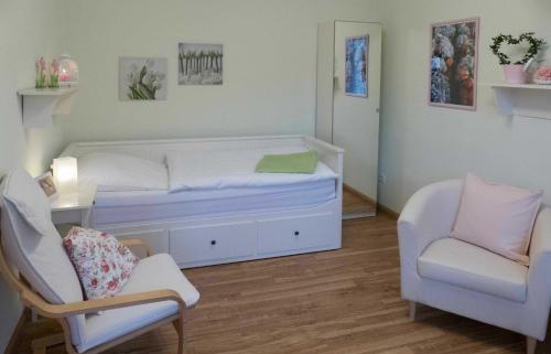 Postel nebo postele na pokoji v ubytování Pension im Adventhaus