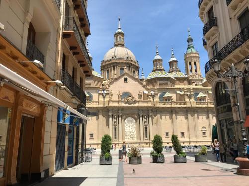 a large building with a dome on top of it at AZ El Balcón de Rey Alfonso II in Zaragoza