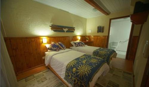 Cama ou camas em um quarto em Guida Residenza Pousada