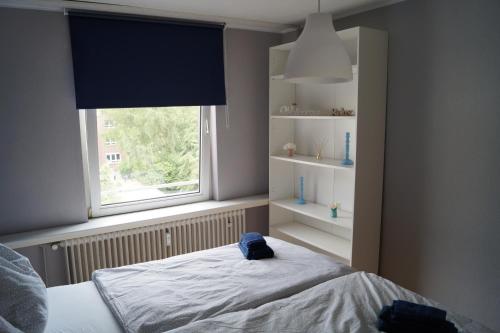 Säng eller sängar i ett rum på Apartment Krefeld City