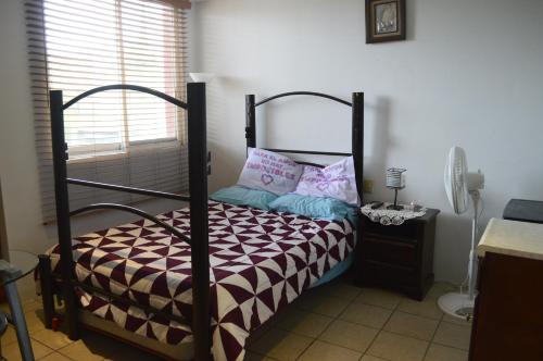 Un pat sau paturi într-o cameră la Loft Maria