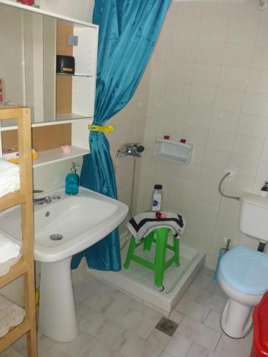 a bathroom with a sink and a toilet at Siviri family house Oikismos Akri - Koroni in Siviri