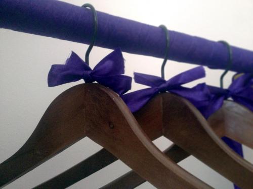 a wooden fence with purple bows on it at Rezydencja Solei Old Town in Poznań