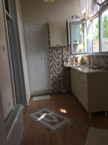 a kitchen with a sink and a counter top at Lazuri Keria Family Guesthouse in Khoni