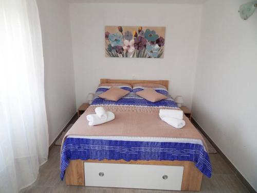 Łóżko lub łóżka w pokoju w obiekcie Apartman Keti