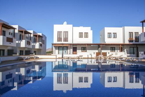 a view of a building with a swimming pool at Aiolos 17 in Puerto Calero