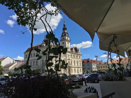 a large building with a clock tower in a city at Riesling House Laa in Laa an der Thaya