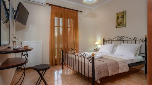 En eller flere senger på et rom på Pothos Villas