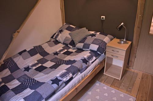 A bed or beds in a room at Bieszczadzki Zakątek :-)
